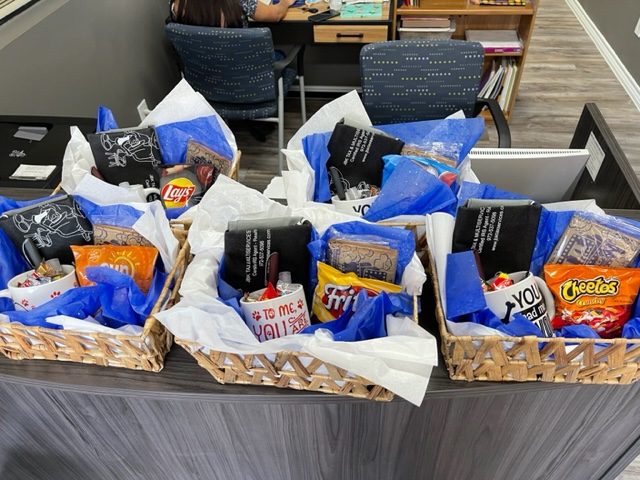 Three prize baskets lined up on the front counter inside the JBK Tax office.